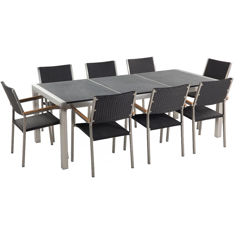 Conjunto de jardín mesa con tablero de piedra natural curtida negra 220 cm, 8 sillas en ratán GROSSETO - BELIANI