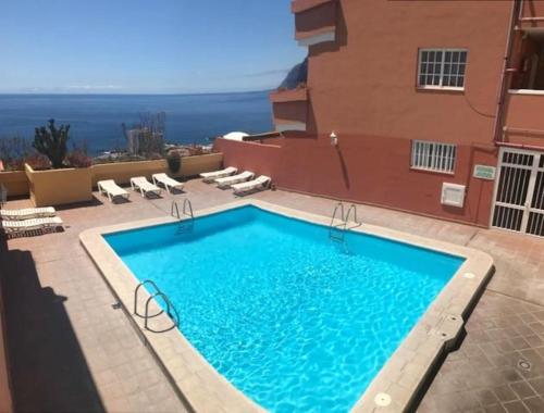 Ofertas en Apartment with one bedroom in Santiago del Teide with wonderful sea view shared pool and terrace (Apartamento), Puerto de Santiago (España)